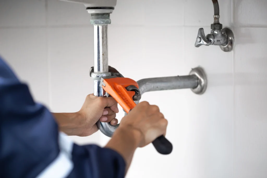 A plumber getting ready for plumbing services in Lakeway, TX.
